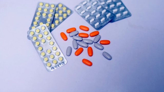 a close up of pills and tablets on a table